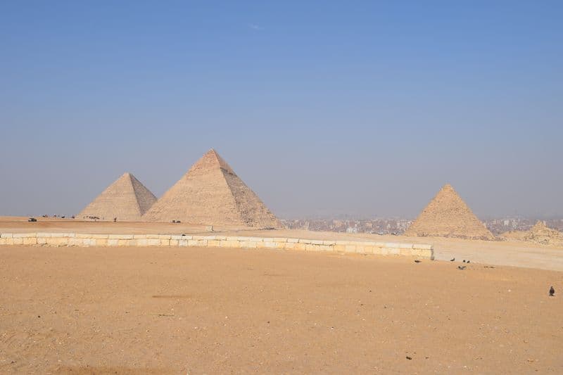 The pyramids of Giza under a clear blue sky